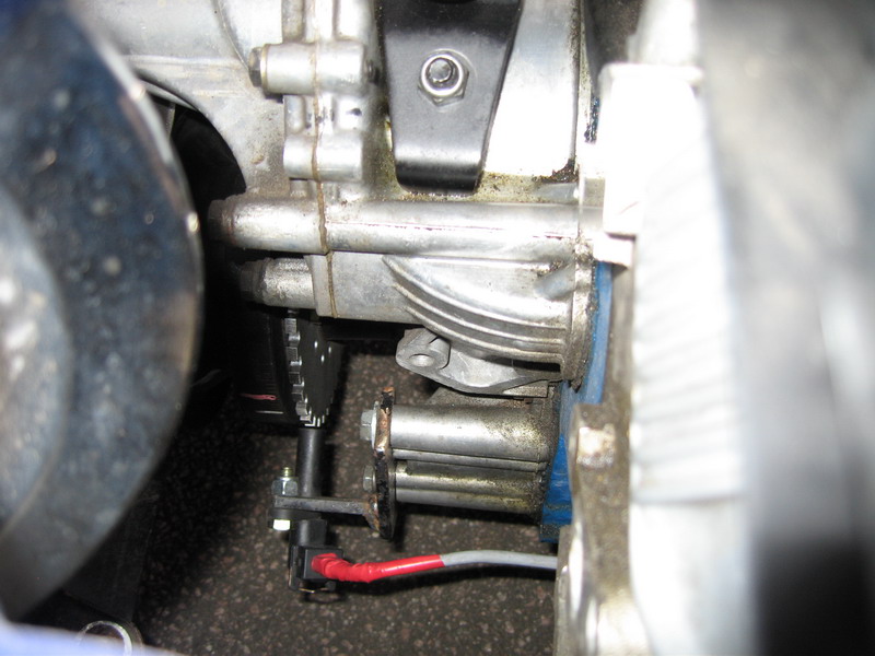 Sensor bracket mounted to spare bosses on the front of the engine